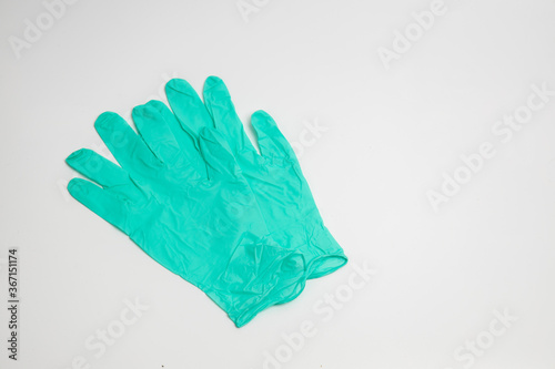 green rubber glove isolated on white background © Teerapong