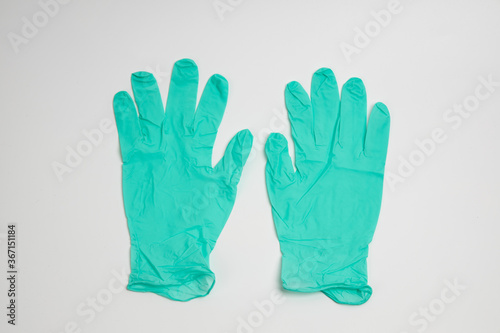 Wallpaper Mural green rubber glove isolated on white background Torontodigital.ca