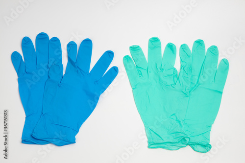 Wallpaper Mural Blue rubber and green rubber glove isolated on white background Torontodigital.ca