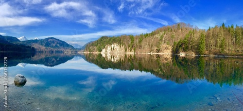 Fototapeta Naklejka Na Ścianę i Meble -  reflection of trees in the lake near Neuschwanstein castle 
