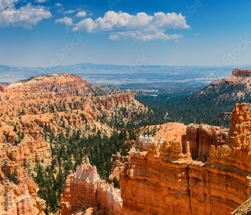 View of steep sandy cliffs, towering spires (hoodoos) and gorges in Bryce Canyon National Park, USA