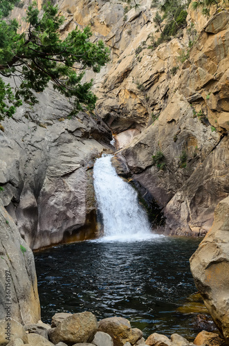 Roaring River Fall. Waterfall cascading over granite monoliths into a rock pool. Sequoia National Forest  California USA
