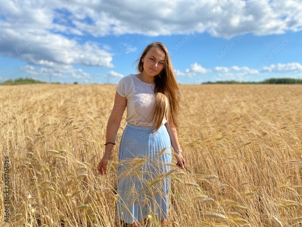 beautiful woman walks in a field with ears, takes pictures in a wheat field
beautiful woman walks in a field with ears, takes pictures in a wheat field
