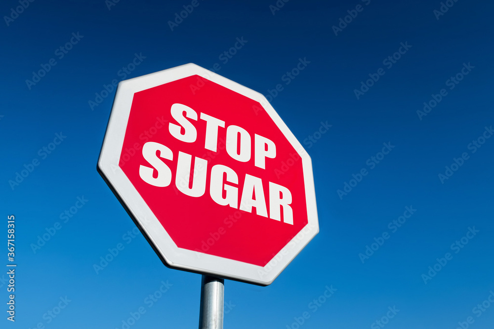 Red STOP traffic sign to cease unhealthy sugar in low-carb keto diet Red STOP traffic sign to cease unhealthy sugar in low-carb keto diet