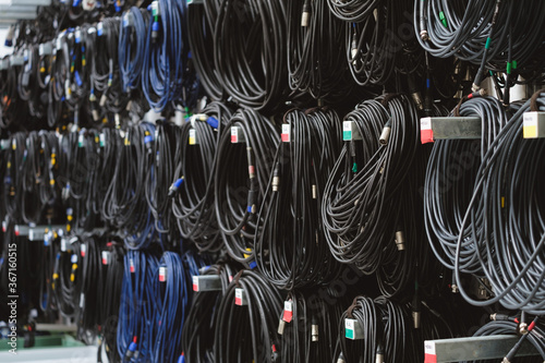 Audio Video cables on racks in warehouse photo