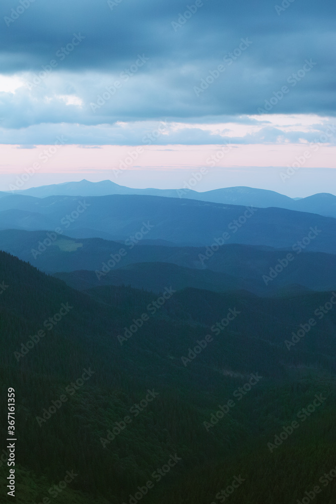 Fototapeta premium Sunset in the cloudy mountains of the Carpathians