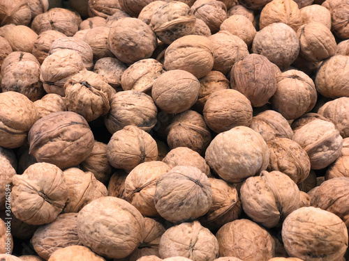 walnut in a shell, close-up, on the counter of the store. Proper nutrition, snacking. The nuts are close-up. Food for the mind, healthy food