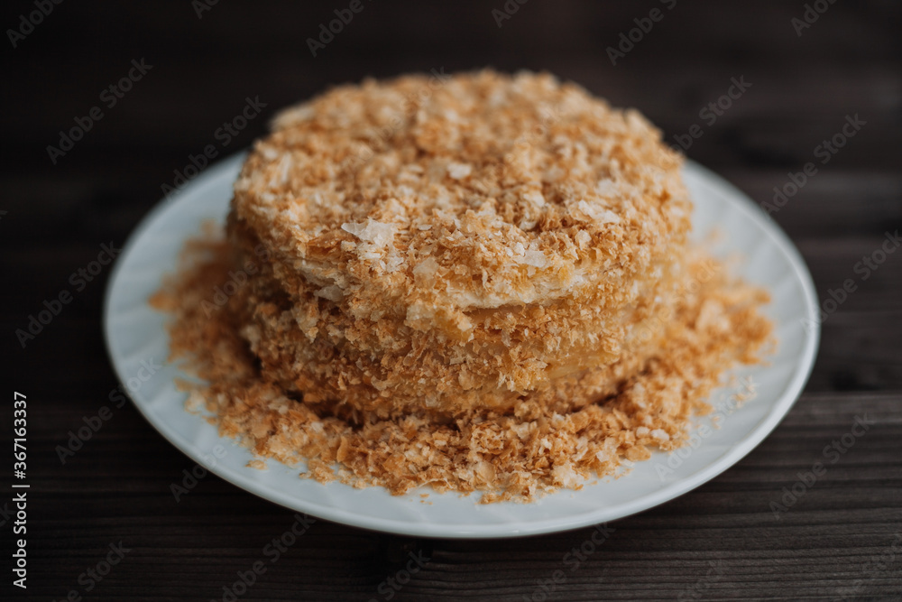 
homemade layer cake with crumb on a dark background