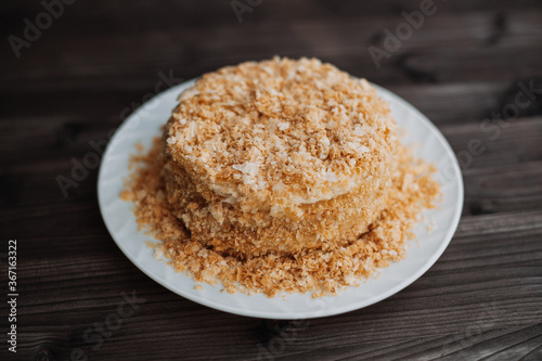  homemade layer cake with crumb on a dark background