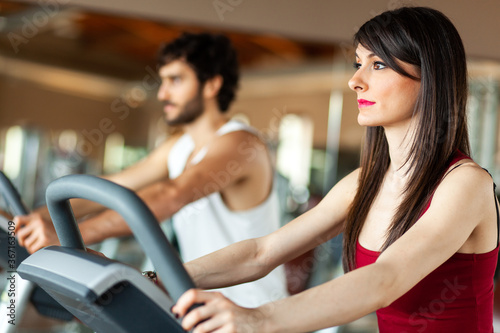 People training cardio in a gym