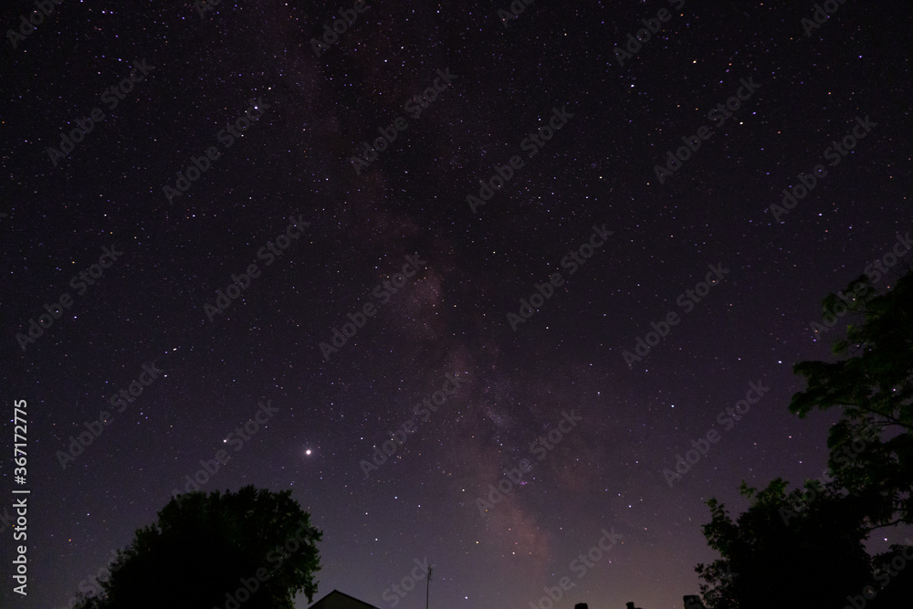 Naklejka premium View of the milky way from the Northern hemisphere of the planet Earth. Beautiful bright night starry sky. Many different constellations in the black night sky. Galaxy with cosmic bodies.
