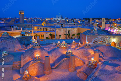 Domes of historical bath and view over the ancient city of Kashan at the twilight, Iran photo