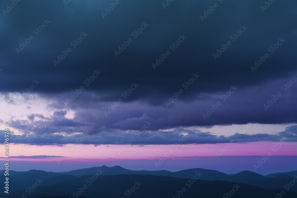 Sunset in the cloudy mountains of the Carpathians