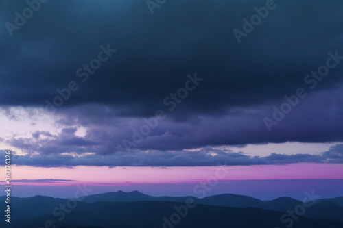 Sunset in the cloudy mountains of the Carpathians © Myshkovskyi