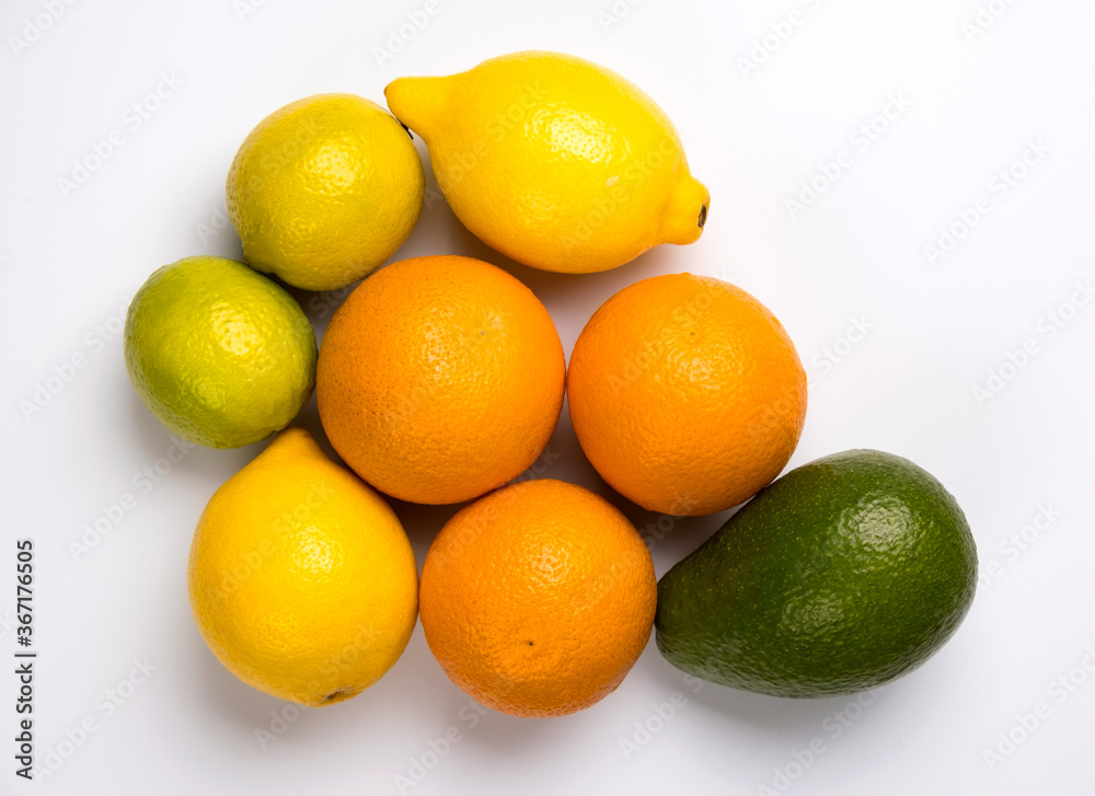 Close up of citrus fruits orange, lemon, avocado and lime isolated on white background. Close up of citrus fruits orange, lemon, avocado and lime isolated on white background.