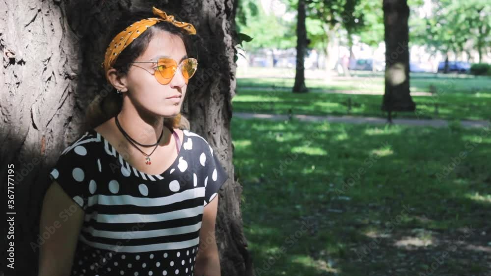fashion hipster girl is thinking of the tree summer sadness park fashion hipster girl is thinking of the tree summer sadness park