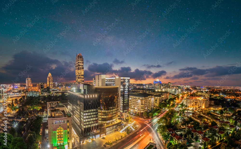 Naklejka premium Panorama shot of Sandton City Johannesburg at night in Gauteng South Africa