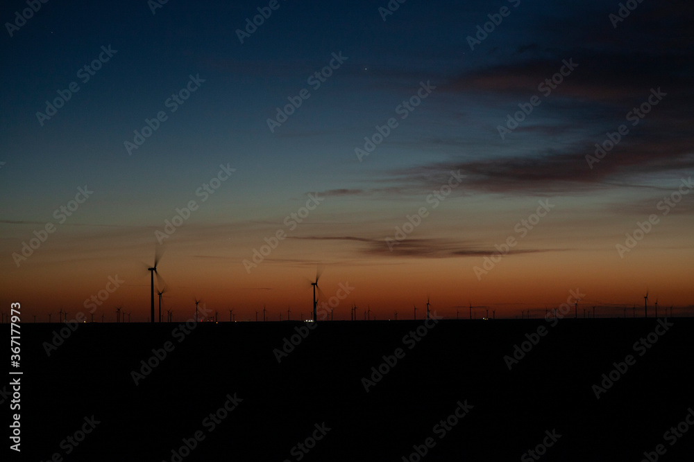 Wind turbines on a  farm at dawn