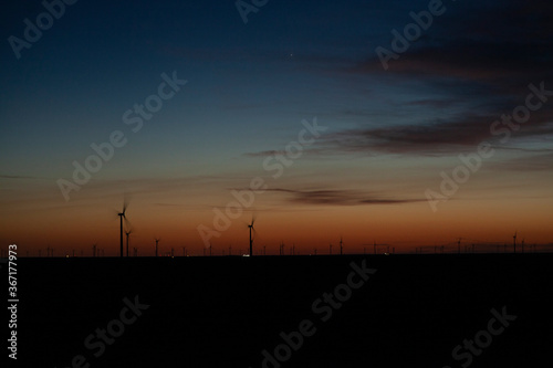 Wind turbines on a farm at dawn