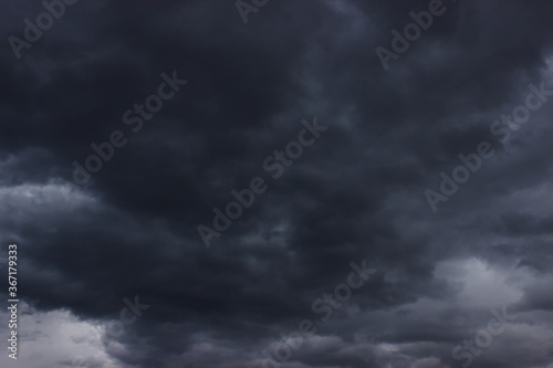 Dark grey and black clouds on sky. Gloomy day concept. Sky before rain. 