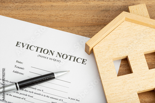 Eviction Notice Document and toy house on table
