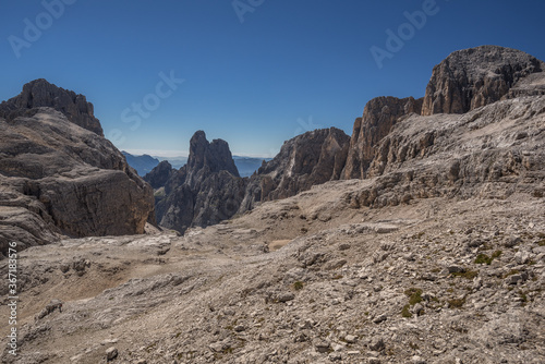Pale di San Martino mountain group summits from L to R, Cima Canali, Cimerlo, Sass Maor, Cima della Madonna, as seen from Pradidali Basso pass, at the foot of Fradusta glacier, Dolomites, Italy.