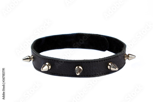 Black collar with black lining, rivets, spikes on a white background. Collar with metal spikes for erotic games. Dressed around the neck. Isolate. Place for text. photo