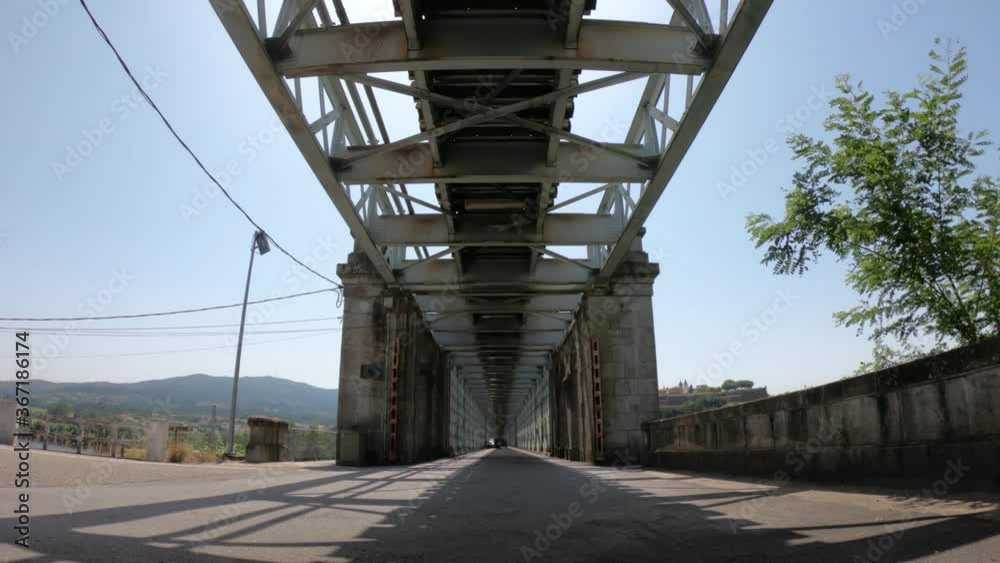 Tui / Spain - July 8, 2020: Valença Road-Railway Bridge, also known as Ponte Internacional de Tui, is a road and rail bridge, crossing the Minho River on the border between Portugal and Spain.