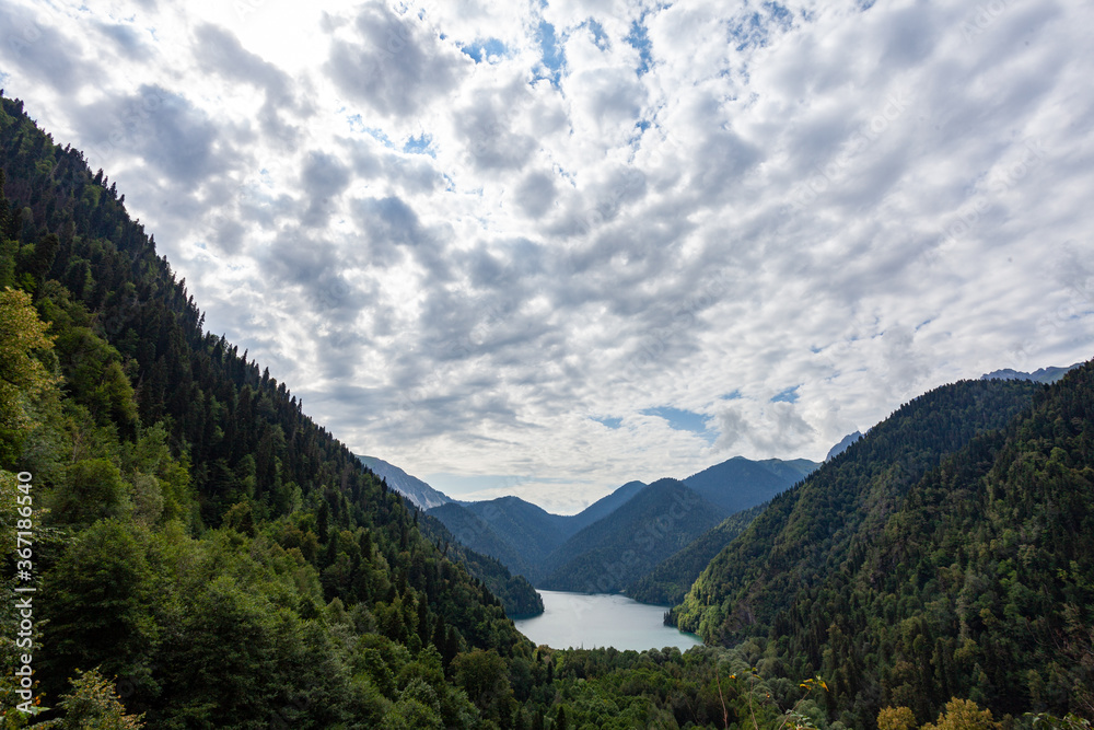 Beautiful lake surrounded by mountains and forest Beautiful lake surrounded by mountains and forest