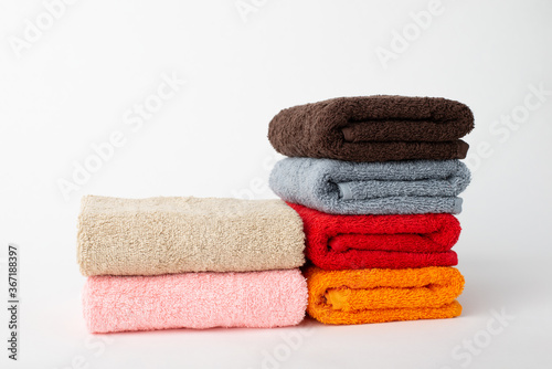 Colorful towels on grey background