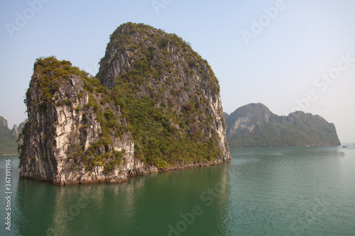 Ha Long Bay, Vietnam, towering limestone islands topped by rainforests, 