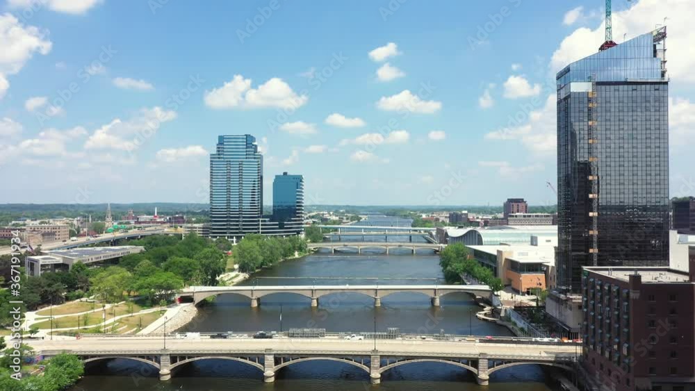 Scenic aerial view above a river in downtown Grand Rapids with bridges and buildings 05