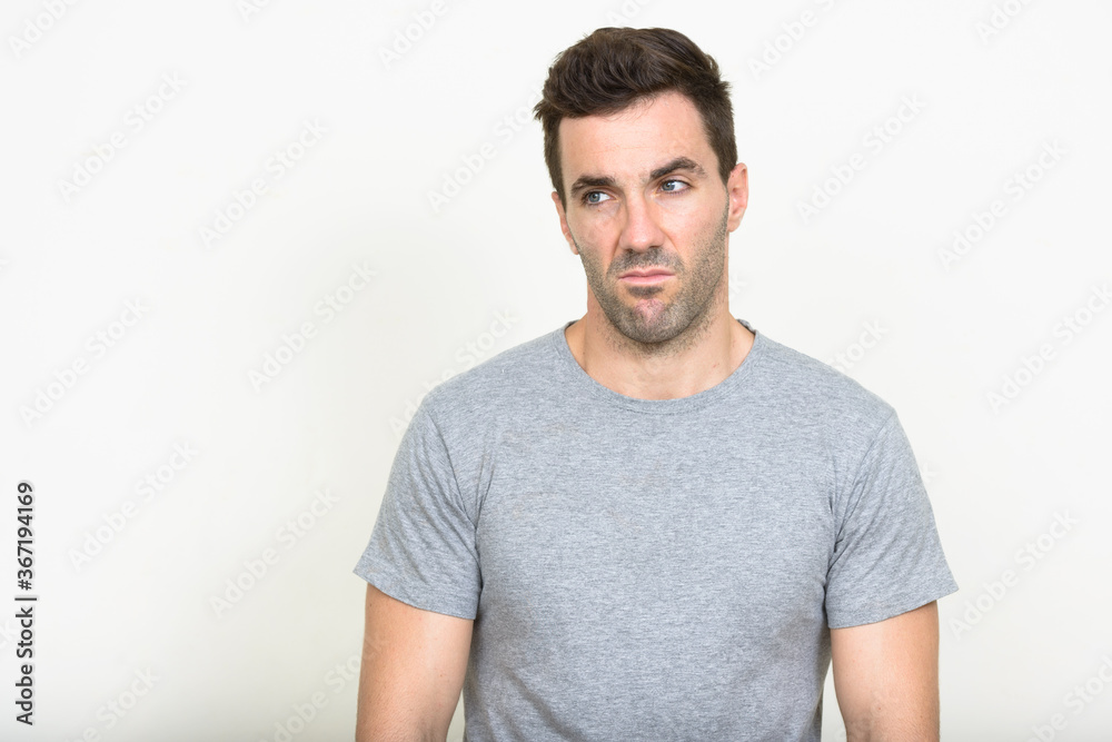 Portrait of handsome Hispanic man with beard stubble Portrait of handsome Hispanic man with beard stubble