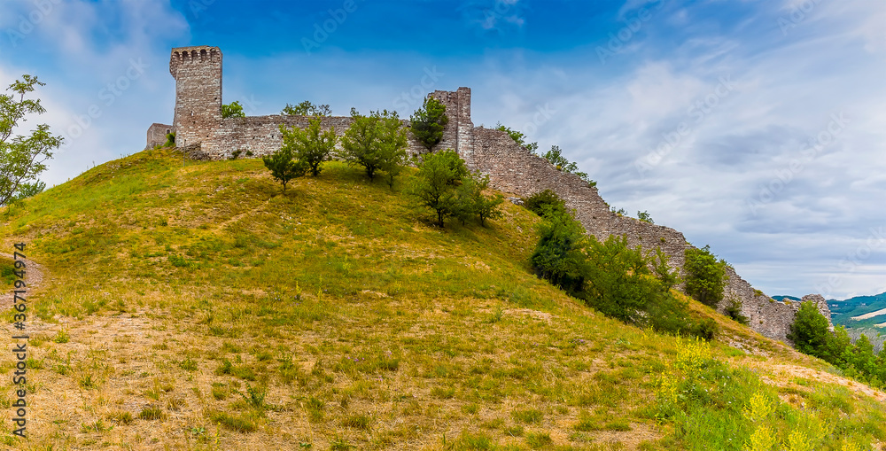 A panorama view towards the Castle Rocca Maggiore above Assisi, Umbria in the summertime