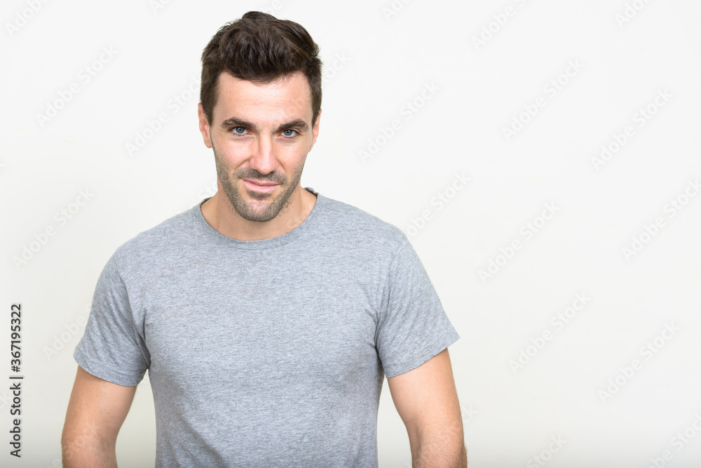 Fototapeta premium Portrait of handsome Hispanic man with beard stubble