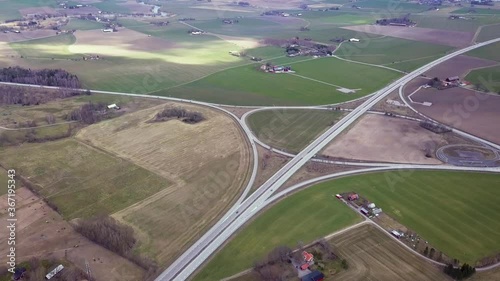 Top down aerial view of highway intersection with moving traffic cars. 
 photo