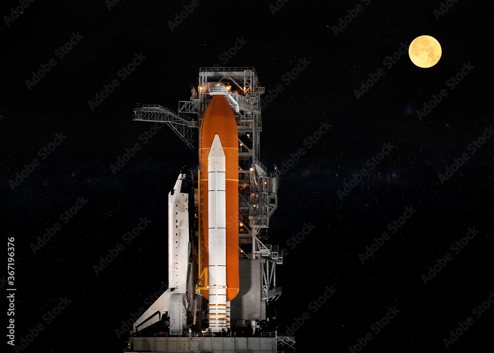Space shuttle launch against starry sky. Selective focus. Elements of this image were furnished by NASA. Space shuttle launch against starry sky. Selective focus. Elements of this image were furnished by NASA.