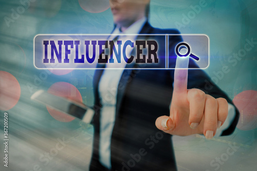 Conceptual hand writing showing Influencer. Concept meaning the an individual who inspires or guides the actions of others Web search digital futuristic technology network connection photo