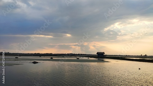 sunset evening with cloudy sky over the river © ChandraShekhar