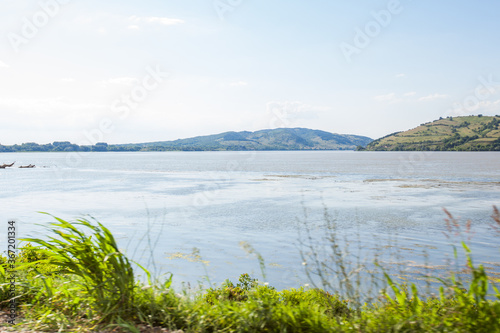 Beautiful river landscape on summer day with blue sky