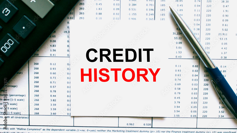 Work smarter text Credit History on white sheet with pen, calculator and tables Work smarter text Credit History on white sheet with pen, calculator and tables