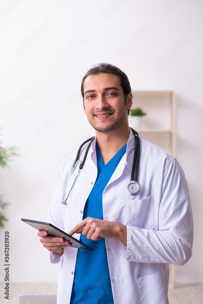 Young male doctor in telemedicine concept Young male doctor in telemedicine concept