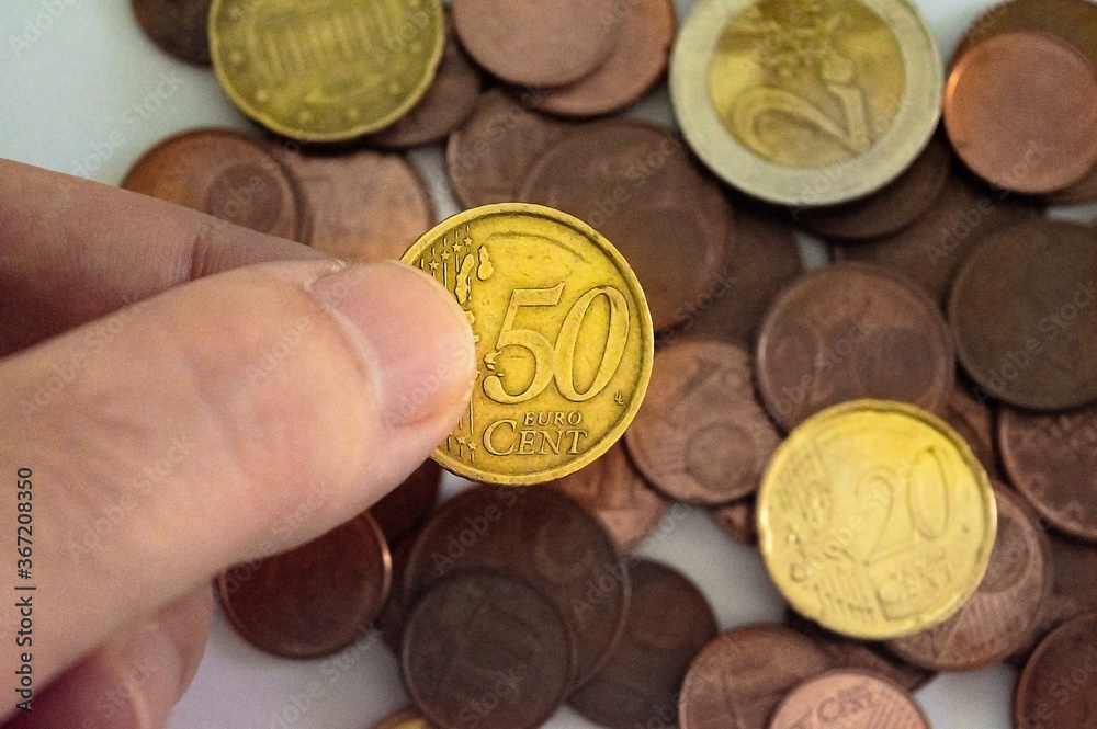 Concept of saving money with assorted coins Concept of saving money with assorted coins