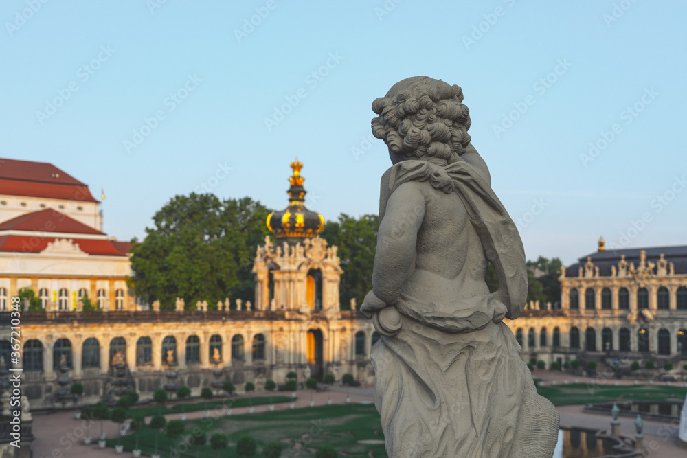 Statue of cupid overviewing Zwinger Garden Statue of cupid overviewing Zwinger Garden