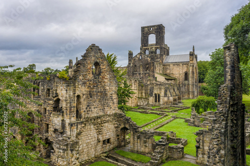 The ruins of Kirkstall Abbey in Leeds, Yorkshire England. Old ruined architecture of the abbey and grounds close to Leeds city centre in West Yorkshire. 