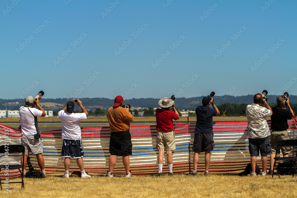 Hillsboro, Oregon; people photographing the various airplanes at the Hillsboro air show. Hillsboro, Oregon; people photographing the various airplanes at the Hillsboro air show.