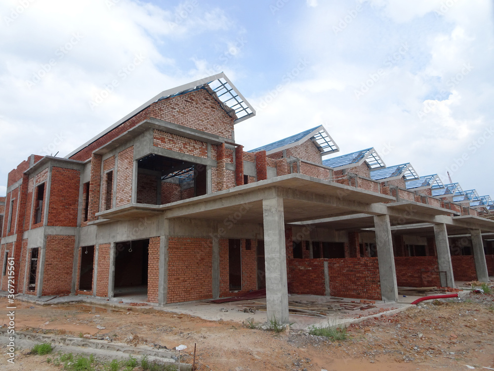 SEREMBAN, MALAYSIA -APRIL 07, 2020: New double story luxury terrace house under construction in Malaysia. Designed by an architect with a modern and contemporary style. SEREMBAN, MALAYSIA -APRIL 07, 2020: New double story luxury terrace house under construction in Malaysia. Designed by an architect with a modern and contemporary style.
