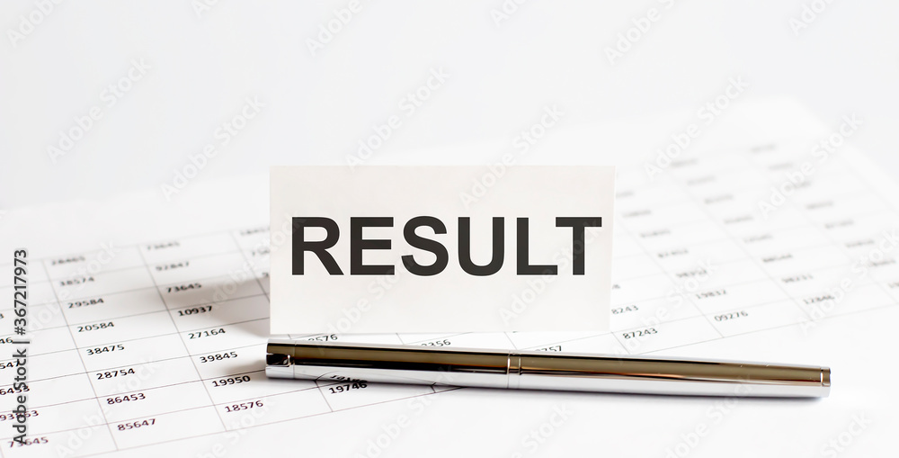 Text RESULT on stickers,pen on the background of documents. Financial bookkeeping, Accounting Concept. Top view. Text RESULT on stickers,pen on the background of documents. Financial bookkeeping, Accounting Concept. Top view.
