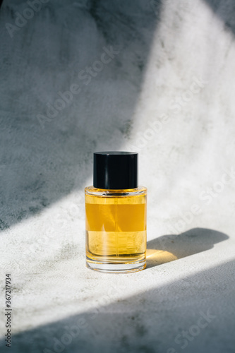 Male fragrance or scented cologne in contrast light photo