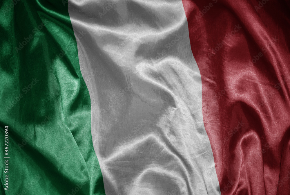 colorful shining big national flag of italy on a silky texture.
